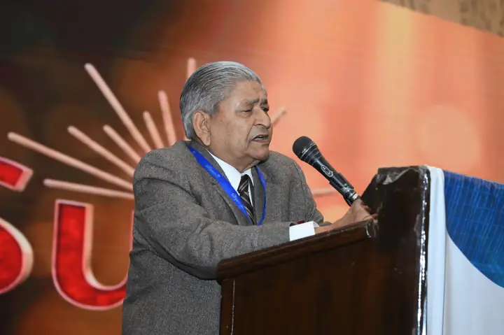 A senior speaker sharing experience during a Suryasthan 2025 session