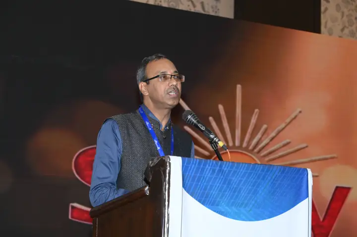 An invited speaker addressing Suryasthan 2025 delegates from the podium